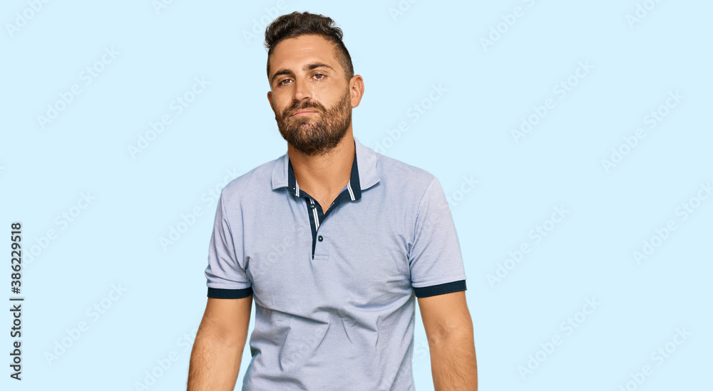 Handsome man with beard wearing casual clothes looking sleepy and tired, exhausted for fatigue and hangover, lazy eyes in the morning. Handsome man with beard wearing casual clothes looking sleepy and tired, exhausted for fatigue and hangover, lazy eyes in the morning.