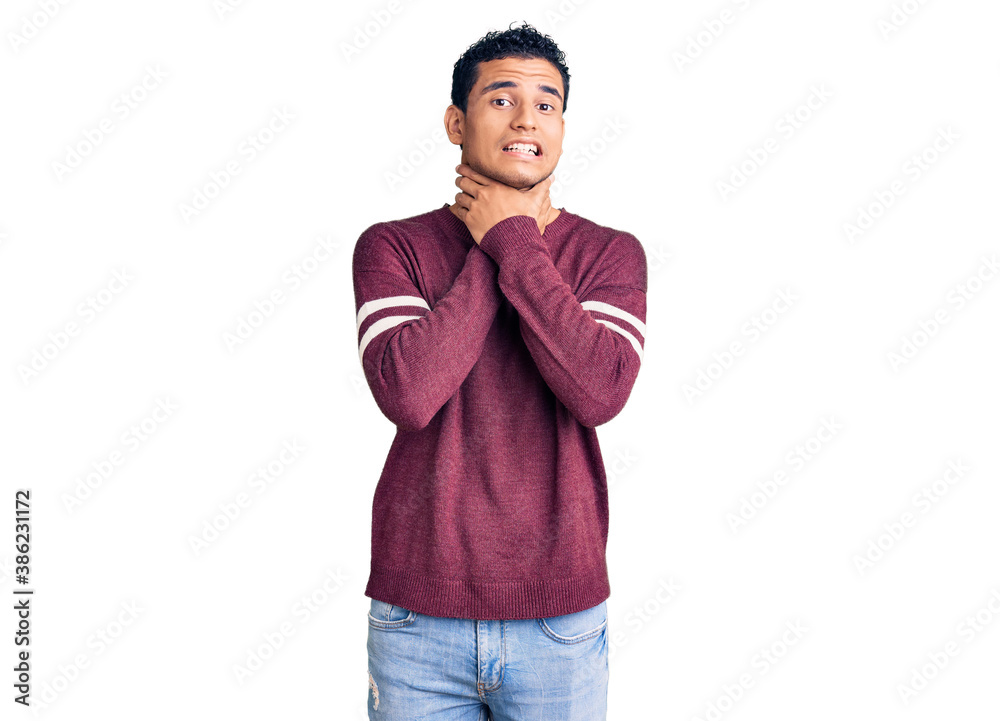 Hispanic handsome young man wearing casual clothes shouting and suffocate because painful strangle. health problem. asphyxiate and suicide concept. Hispanic handsome young man wearing casual clothes shouting and suffocate because painful strangle. health problem. asphyxiate and suicide concept.