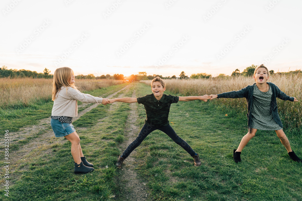Portrait of young girls holding hands outdoors Portrait of young girls holding hands outdoors