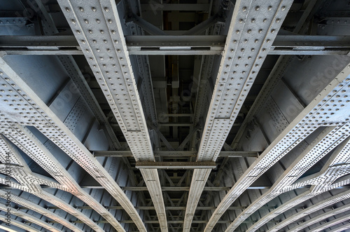 Beneath Blackfriars Railway Bridge in London, UK.  The strong steel beams with rivets underneath the bridge hold the structure in place.  Blackfriars railway station is built on top of the bridge. photo