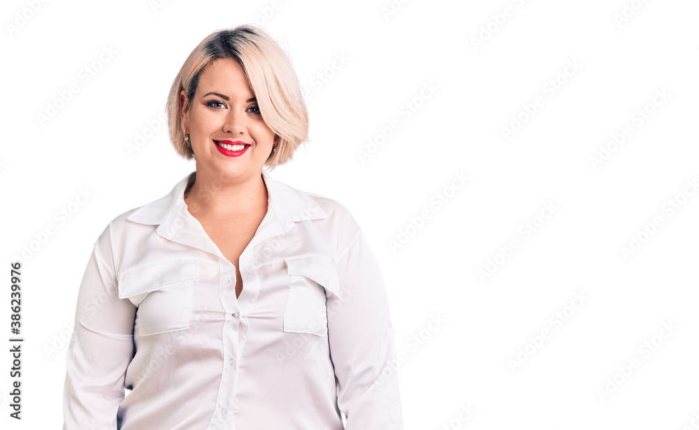 Young blonde plus size woman wearing casual shirt with a happy and cool smile on face. lucky person. Young blonde plus size woman wearing casual shirt with a happy and cool smile on face. lucky person.