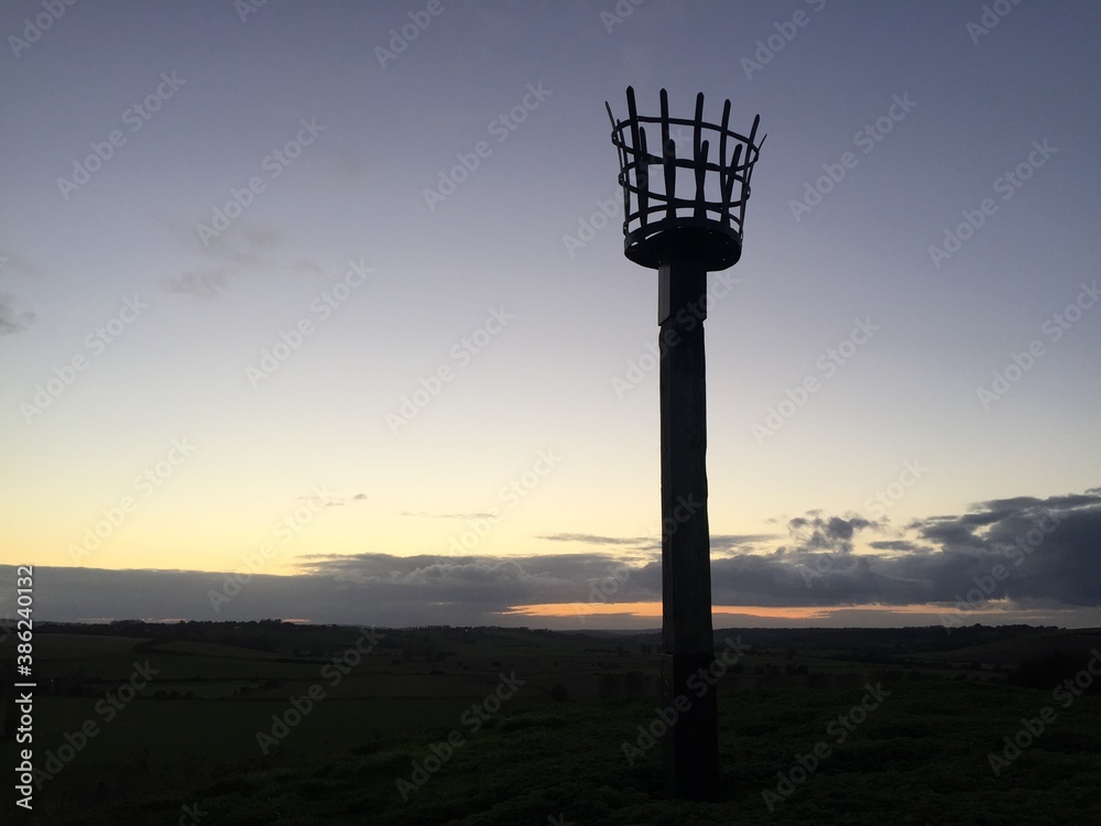 Beacons or fire beacon are a warning signal system of historical Uk lit on hills in coastal areas of England and Scotland to signal invading lit in medieval Beacons or fire beacon are a warning signal system of historical Uk lit on hills in coastal areas of England and Scotland to signal invading lit in medieval