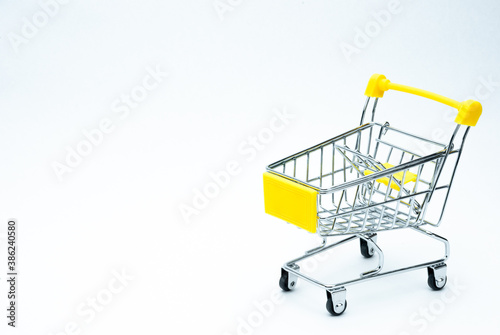 Empty metal shopping cart isolated over white background