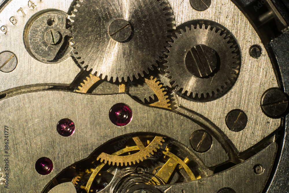 closeup of the gears of an antique clockwork