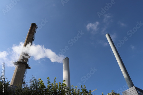 Cheminées de la chaufferie urbaine de Vénissieux, chaufferie alimentée par biomasse, gaz et fioul, et fonctionnant en cogénération , ville de Vénissieux, département du Rhône, France photo