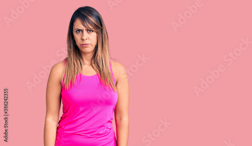 Young beautiful woman wearing sportswear skeptic and nervous  frowning upset because of problem. negative person.