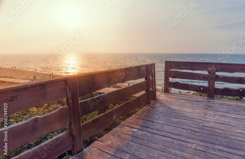 Boardwalk with railings on the beach.