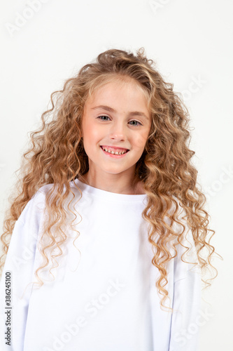 curly girl in white long sleeve t-shirt