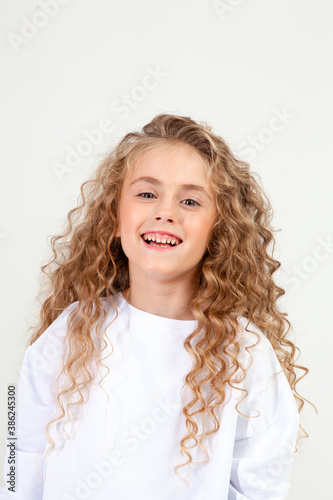 curly girl in white long sleeve t-shirt
