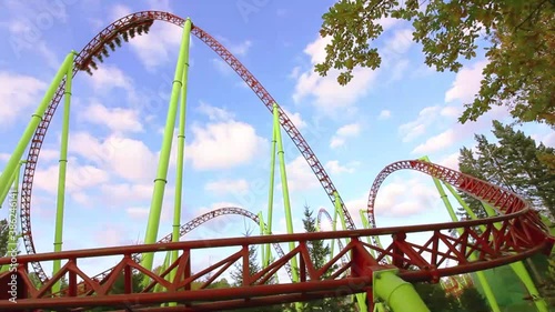 Roller Coaster Loops ride and people in carts 
