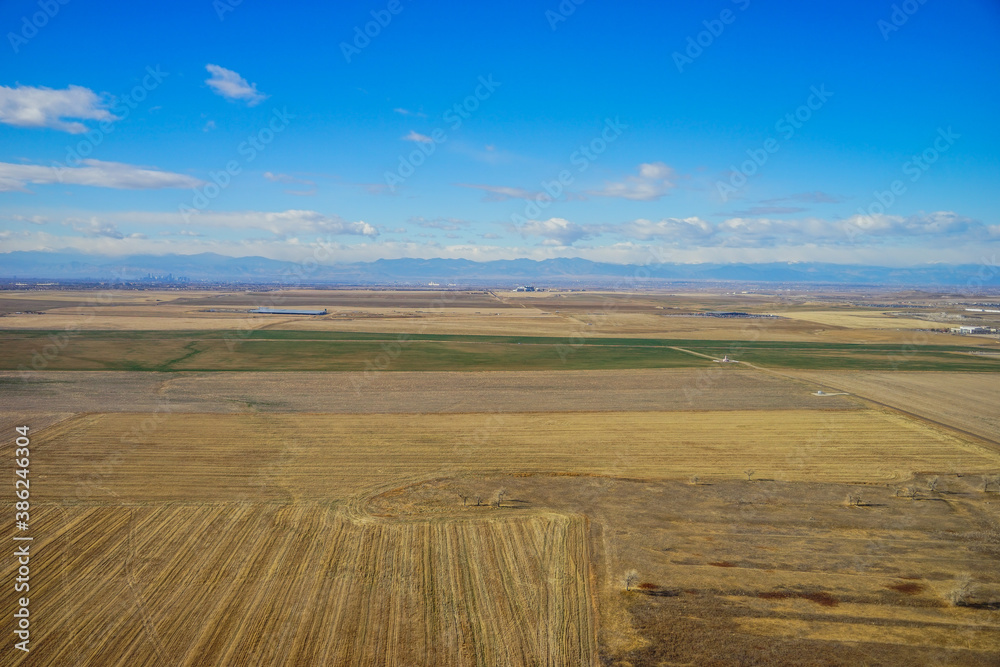 Fototapeta premium Aerial view of of farm in suburban of Denver in Colorado and the country road 