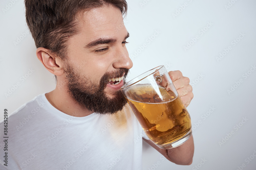 emotional man with a large mug of beer alcoholic drink gesturing with his hands drunken state emotional man with a large mug of beer alcoholic drink gesturing with his hands drunken state