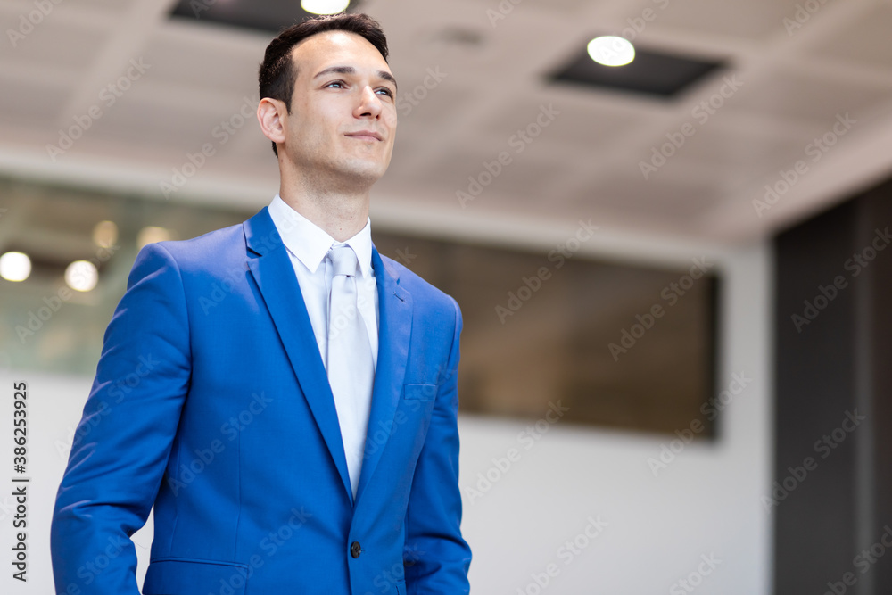 Young manager in his office in a pensive expression Young manager in his office in a pensive expression
