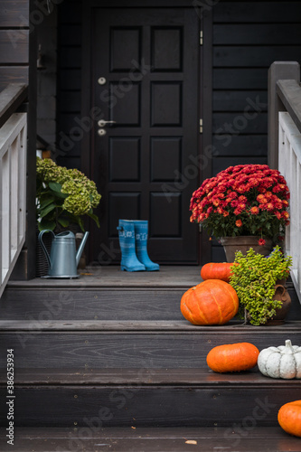 Traditional style porch, front steps decoration at Halloween, Thanksgiving season