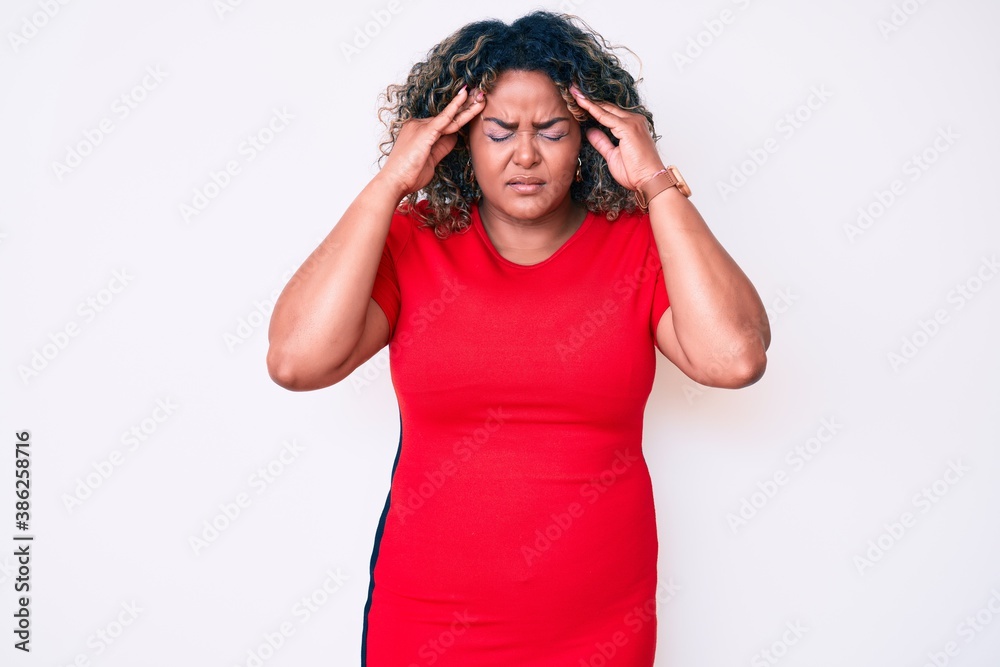 Naklejka premium Young african american plus size woman wearing casual clothes with hand on head for pain in head because stress. suffering migraine.