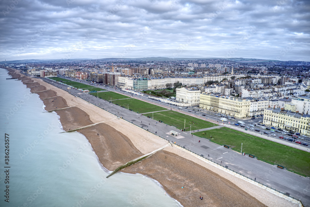 Aerial view of Hove Seafront with the beautiful promenade and the elegant buildings along the coastline.