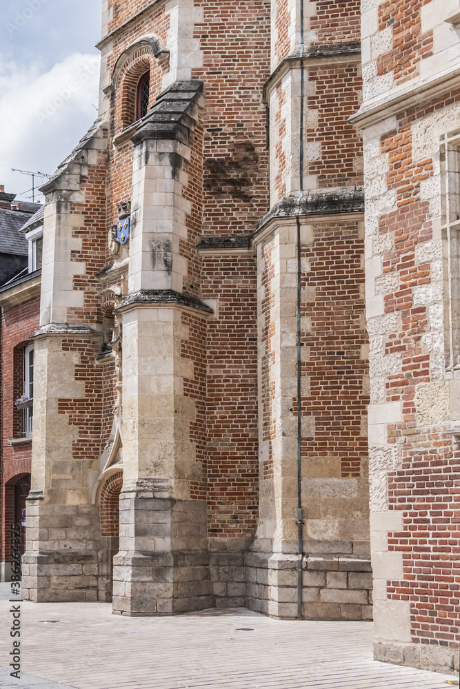 Beautiful architecture of ancient French buildings: Logis du Roi (from beginning of XVI century) - brick and stone building with tower, former hotel Trois-Cailloux. Amiens, Picardy, Somme, France.