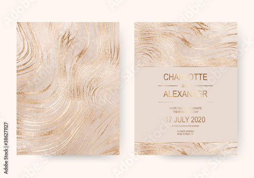 Elegant marble wedding invitation cards with gold foil stripes.