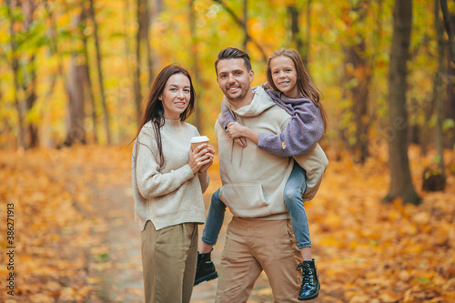 Portrait of happy family of three in autumn day © travnikovstudio