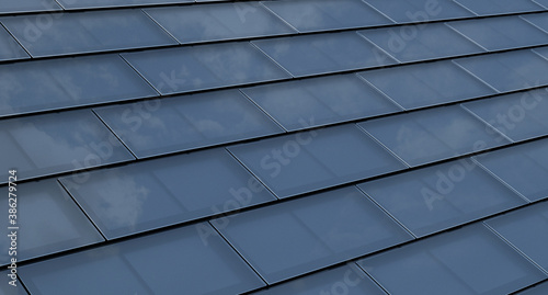 Solar Roof Shingles. Building-integrated photovoltaics system consisting of modern monocrystal black solar roof tiles.