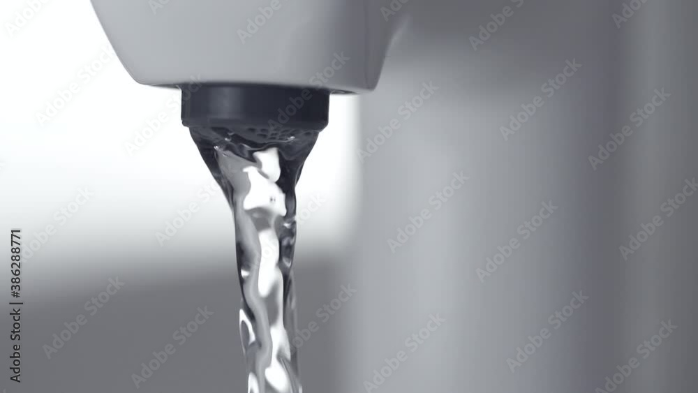Water starts flowing From The Bathroom faucet Tap. drink water from infrastructure Water starts flowing From The Bathroom faucet Tap. drink water from infrastructure