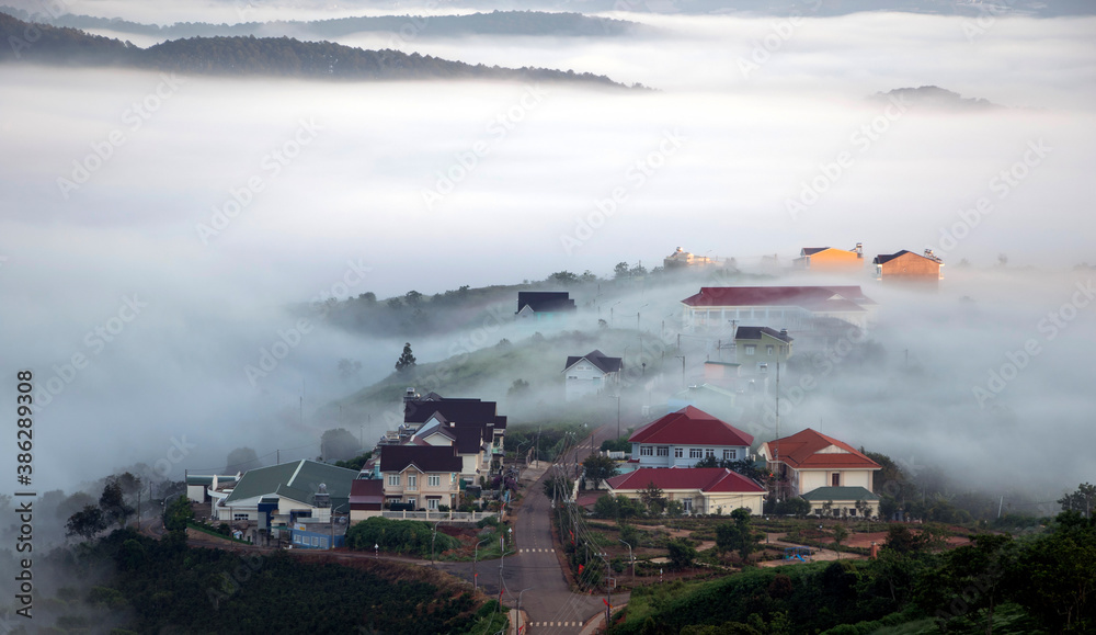 Fototapeta premium Small town in the clouds