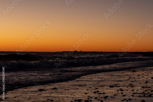 Waves break at sunset on Herring Cove Beach in Provincetown, MA © Joshua Conover