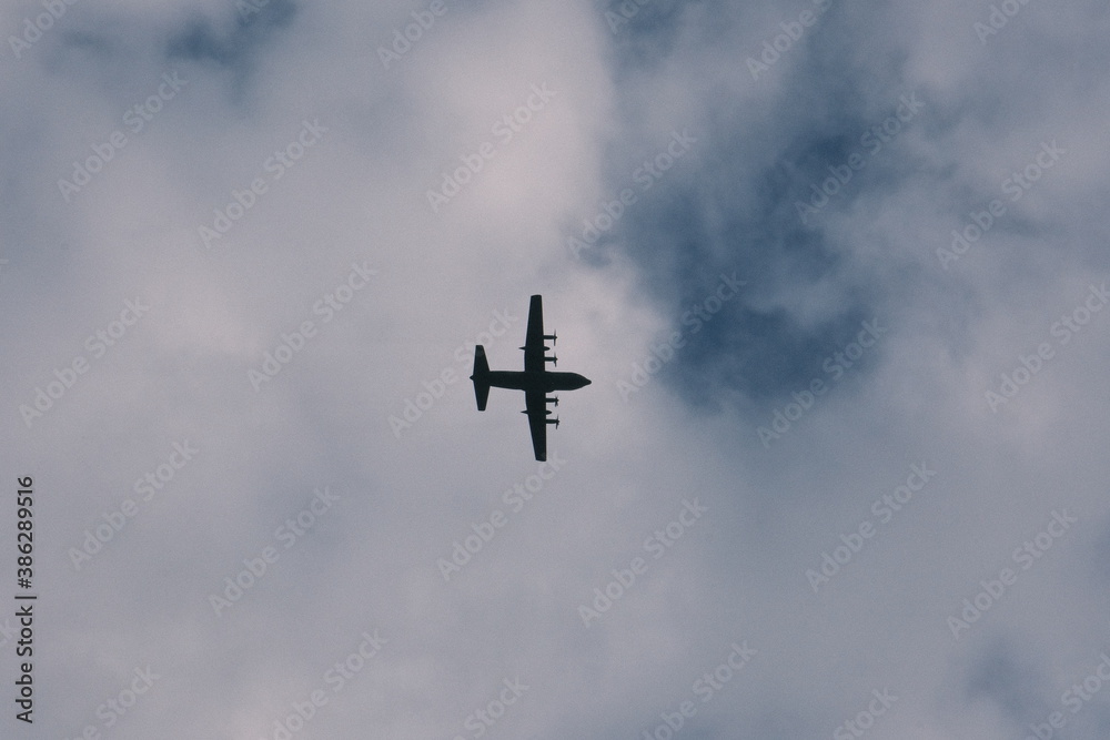 military aircraft in flight viewed from below military aircraft in flight viewed from below