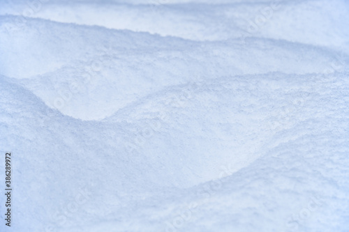 Snow texture. Natural winter background with snow waves © Serg Zastavkin