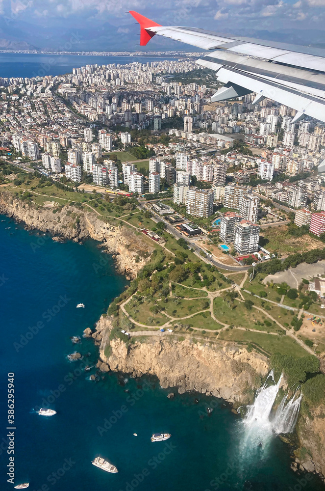 Antalya cityscape with famous Duden waterfall seen from airplane window, Turkey