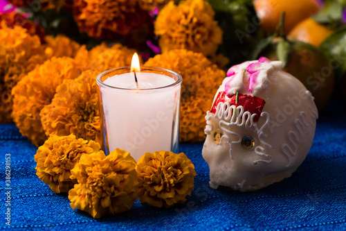 Day of the Dead candle and sugar skull photo