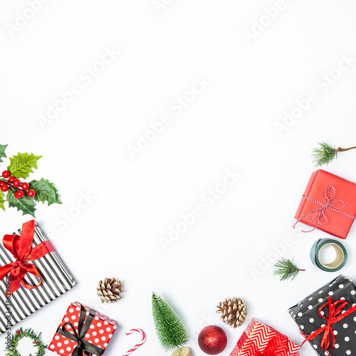 Obraz na płótnie Gift boxes wrapped in striped and dotted black and white and red paper over white background. Christmas presents and ornament preparation. Copy space. w salonie