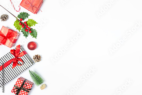 Obraz na płótnie Gift boxes wrapped in striped and dotted black and white and red paper over white background. Christmas presents and ornament preparation. Copy space. w salonie