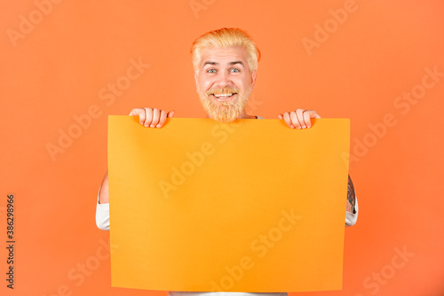 Man holding empty sheet of a paper. Man holding blank card. Man show clear paper. Sheet template. photo