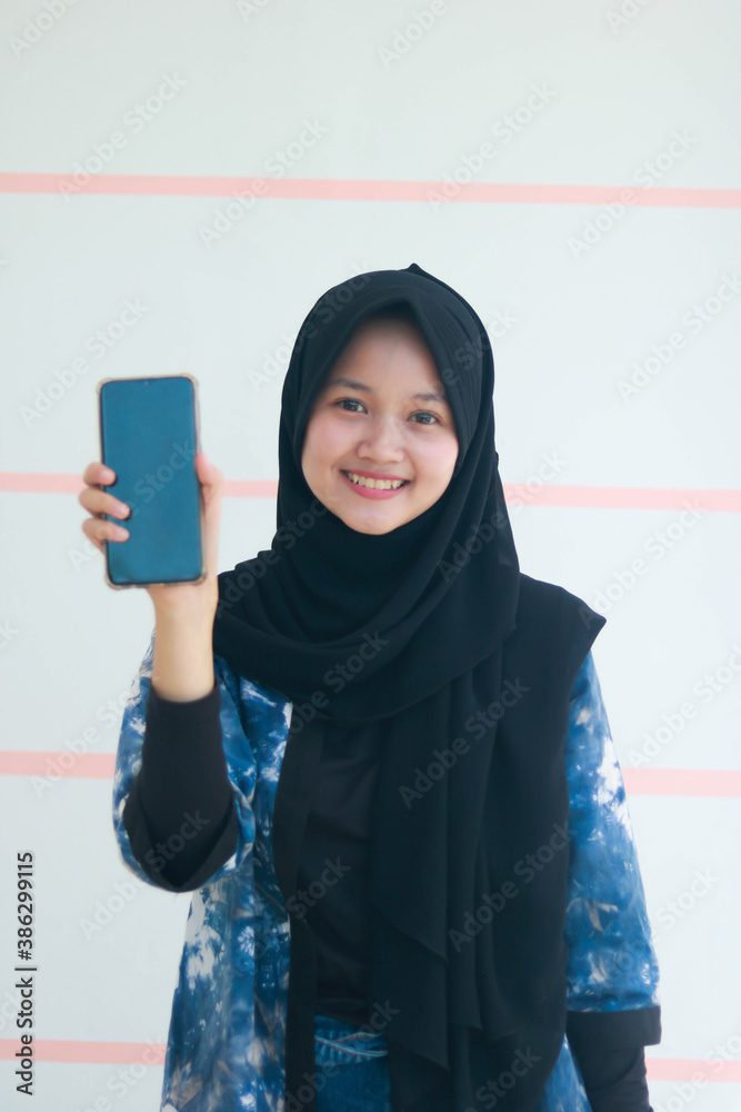 Fashion portrait of young beautiful asian muslim woman with wearing hijab. Fashion portrait of young beautiful asian muslim woman with wearing hijab.