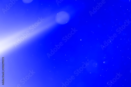 Abstract bokeh background with blue and light lines