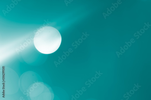 Abstract bokeh background with blue and light lines