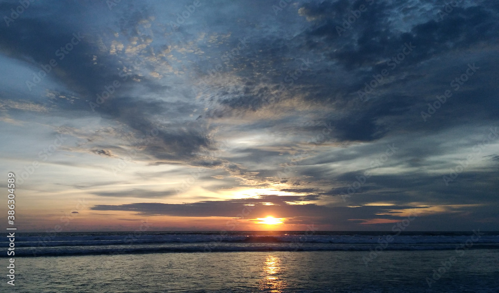 Amazing sunset at Petitenget beach Bali Indonesia
