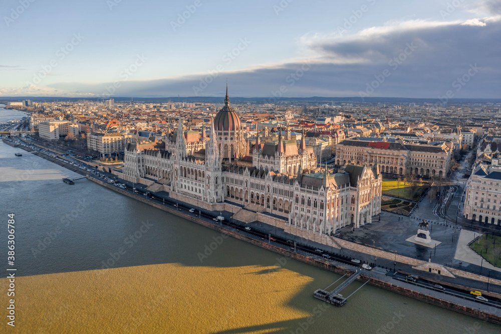 Aerial drone shot of Hungarian Parliament in Budapest winter morning glow