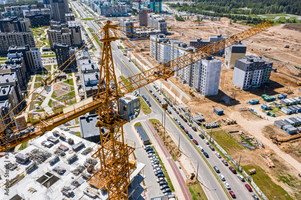 development of new residential area. building site with high-rise building and cranes. aerial view - obrazy, fototapety, plakaty 