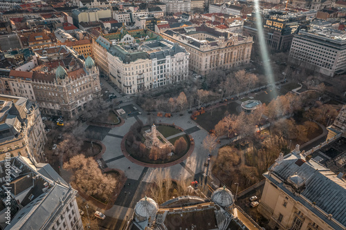 Aerial drone shot of Liberty Square Budapest downtown in winter monrning sun flare