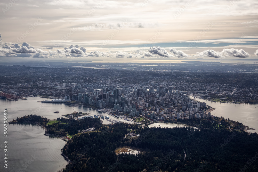 Downtown Vancouver, British Columbia, Canada. Aerial View of the Modern Urban City, Stanley Park, Harbour and Port. Viewed from Airplane Above during a sunny morning. Artistic Render