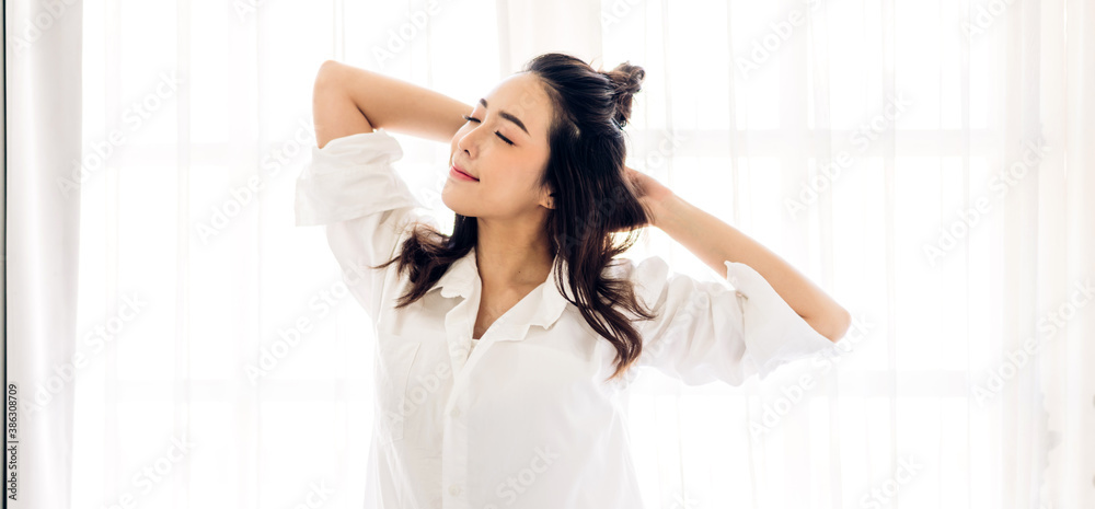 Smiling of cheerful beautiful pretty asian woman clean fresh healthy white skin posing in white clothes.Girl felling relaxing and enjoy time on the bed at home.asia beauty Smiling of cheerful beautiful pretty asian woman clean fresh healthy white skin posing in white clothes.Girl felling relaxing and enjoy time on the bed at home.asia beauty