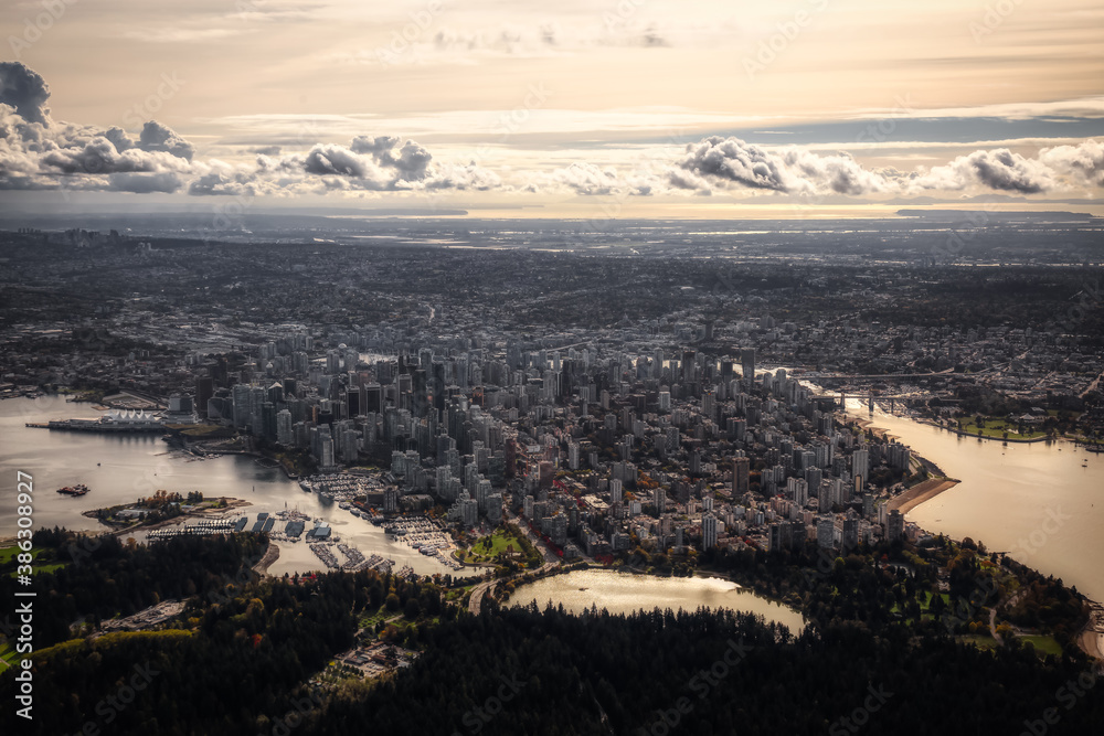 Downtown Vancouver, British Columbia, Canada. Aerial View of the Modern Urban City, Stanley Park, Harbour and Port. Viewed from Airplane Above during a sunny morning. Artistic Render