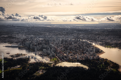 Downtown Vancouver, British Columbia, Canada. Aerial View of the Modern Urban City, Stanley Park, Harbour and Port. Viewed from Airplane Above during a sunny morning. Artistic Render © edb3_16
