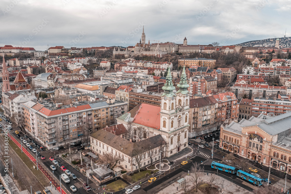 Aerial drone shot of facade of St. Anne Parish church during Budapest sunrise