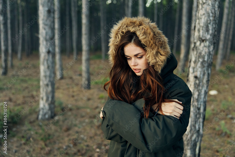 woman in warm jacket forest nature walk spring woman in warm jacket forest nature walk spring