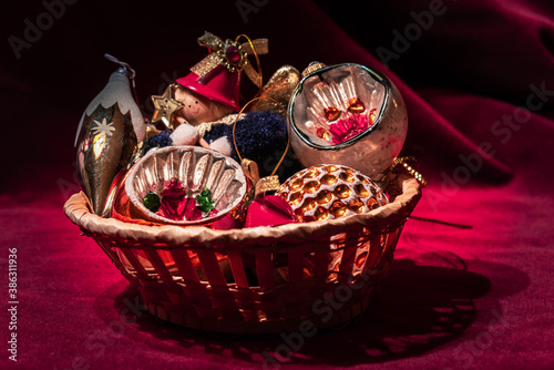 The Basket with Old Christmas baubles. Selective focus.