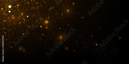Vector abstract background with glowing golden particles. Defocused glitter effect. Sparkling lights on black.	