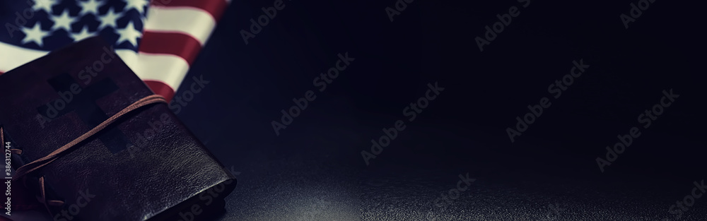 American flag and holy bible book on a mirror background. Symbol of the ...
